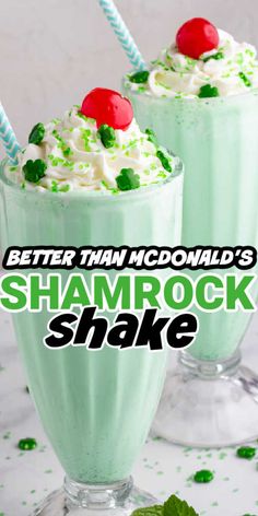 two glasses filled with shamrock shake on top of a table