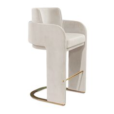 a white chair with gold trim around the armrests and back rests against a white background