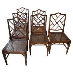 set of four bamboo dining chairs with rattan seats and cane back backs, late 20th century