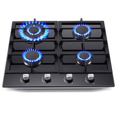 a gas stove with blue flames on the burner and four burners in it