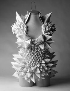 a mannequin made out of folded paper