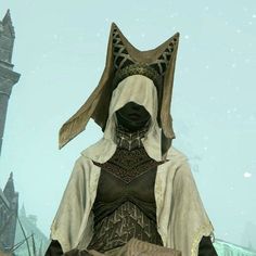 an image of a person dressed up in medieval clothing and headgear standing on a snowy day