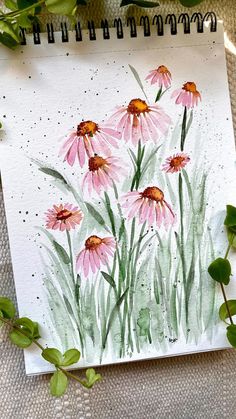 watercolor painting of pink flowers on white paper