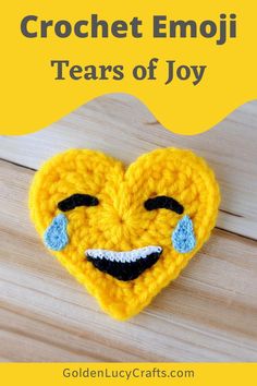 a crocheted heart with the words tears of joy emoji on it