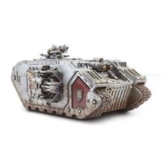 a toy tank with metal parts on it