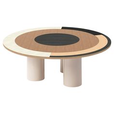 a round table with two black and white circles on the top, in front of a white background