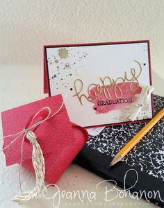 a close up of a greeting card on a table with a pen and paper bag