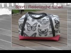 a white and pink bag with butterflies on it