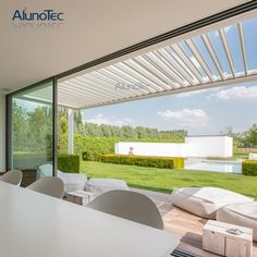 an open living room and dining area with sliding glass doors