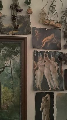 there are many paintings and pictures on the wall