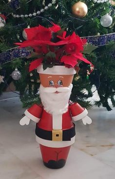 a christmas planter with poinsettis in it