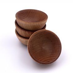 three wooden bowls stacked on top of each other