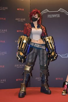 a woman with red hair wearing armor and boots