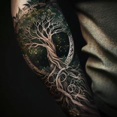 a man with a tree tattoo on his arm and half sleeve is shown in the dark