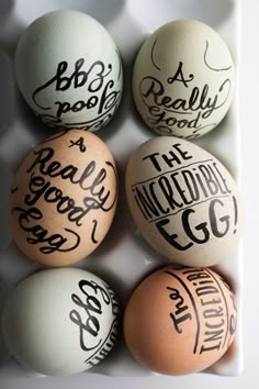 six eggs with handwritten words on them