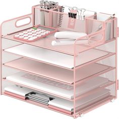 a pink desk organizer with drawers and office supplies