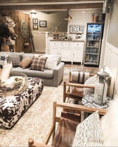 a living room filled with lots of furniture next to a wall mounted clock on the wall