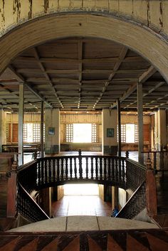 an old building with wooden floors and railings