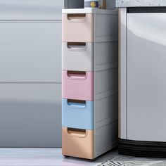 a multicolored file cabinet next to a refrigerator