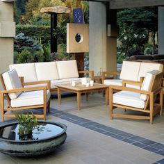 an outdoor living area with furniture and plants