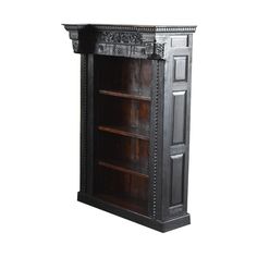 an old wooden bookcase with carvings on the top and bottom shelf, isolated against a white background