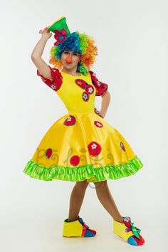 a woman dressed as a clown posing for the camera