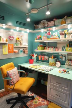 a room with a desk, chair and shelves filled with crafting supplies on it