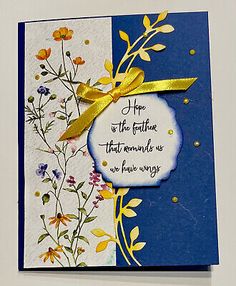 a blue and white card with yellow ribbon on it that says, hope is the father