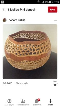 a wooden bowl sitting on top of a table