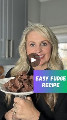 a woman holding a plate with chocolate fudge on it and the words easy fudge recipe