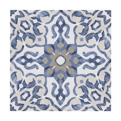 a blue and white tile with an intricate design