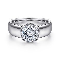 a white gold engagement ring with a round cut diamond