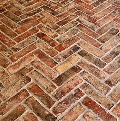 an image of a brick floor that looks like it is made out of red bricks