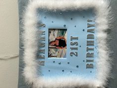 a blue and white photo frame with the words happy 21st birthday written in silver on it