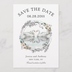 save the date card with two doves and floral wreath on it, in white