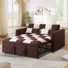 a brown and white checkered sectional sofa in a living room with wood flooring