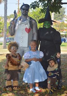 a group of people in costumes standing next to each other