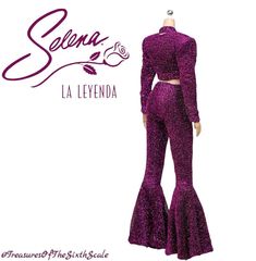 a mannequin wearing a purple outfit with long sleeves and bell bottoms, standing in front of a white background