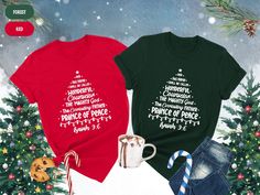 two t - shirts with christmas trees and candy canes next to them on snow covered ground