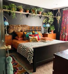 a bed room with a neatly made bed and lots of plants