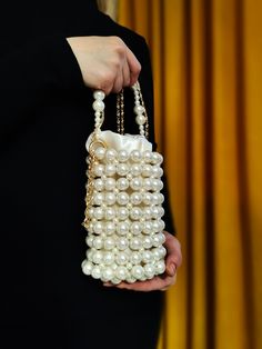 Meet our Cylinder Pearl Bag that combines elegance and sophistication! Perfect for special events, evening functions, or any special occasion. This handcrafted bag, adorned with pearl details, will elevate your look to impressive and stylish heights. Order now to create unforgettable moments with your loved ones! ✨👜 #PearlBag #EveningBag #Handcrafted #Clutch #ElegantFashion Cream Evening Bag With Pearl Handle, Elegant White Bags With Pearl Chain, Cream Evening Bag With Pearl Handle For Gift, Elegant Bags With Pearl Chain, Cream Evening Bag With Pearl Handle As Gift, Cream Pearl Evening Bag For Party, Cream Bags With Pearl Embroidery For Events, Evening Beige Shoulder Bag With Pearl Handle, Elegant White Handmade Shoulder Bag