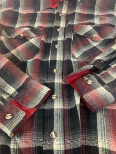 "This warm flannel shirt is a synthetic blend that is still in excellent condition. Beautiful red, black and white plaid with variations and blends that subtle depth to the fabric. 85% Acrylic 15% Polyester. Made by Van Heusen in a Korea. Size L -Model size men's Large -Approximate measurement when laid flat: 25\" armpit to armpit 20\" shoulder to shoulder 25\" sleeve 31\" collar to hem" Plaid Long Sleeve Flannel Shirt With Button Closure, Plaid Long Sleeve Shirt With Snap Buttons, Plaid Shirt With Snap Buttons And Long Sleeves, Plaid Shirt With Snap Buttons, Plaid Shirt With Buttons For Winter, Plaid Collared Flannel Shirt With Button Closure, Classic Plaid Flannel Shirt, Classic Plaid Flannel Shirt For Winter, Plaid Flannel Shirt With Button Closure