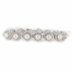 a white pearl and diamond bracelet