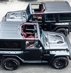 three black and silver jeeps parked next to each other