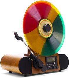 an old fashioned record player with a multi - colored record