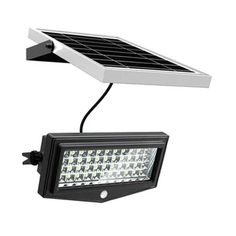 a solar powered flood light on a white background with clipping lights attached to it