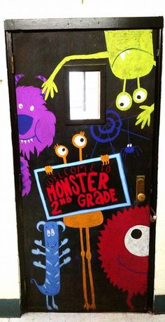 a door with monsters painted on it and a sign that says, monster grade