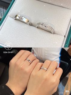 two women's hands holding onto their wedding rings in a jewelry box with diamonds on them