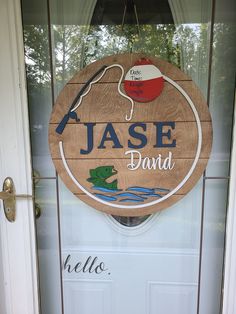 a wooden sign hanging on the front door of a house that says jase david