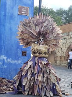 a woman in a costume made out of leaves